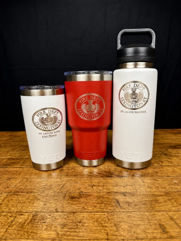 Three engraved YETI Ramblers showing Lexington KY fire department logo and personalized names