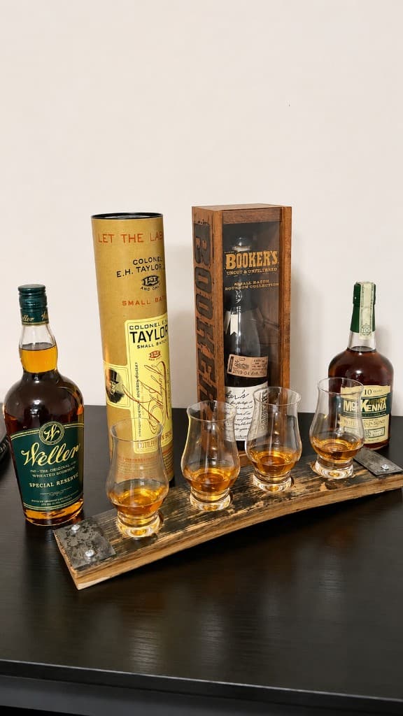Handcrafted bourbon barrel stave flight board with Glencairn glasses and bottles
