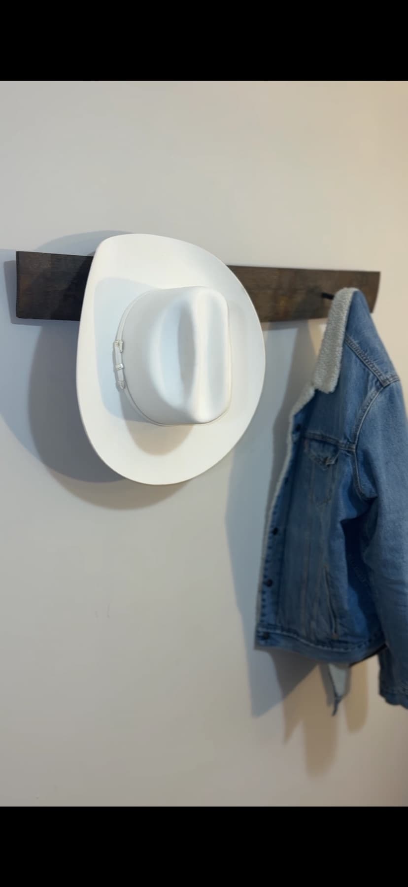 Reclaimed bourbon stave coat rack on a wall